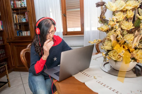 Woman Works Home Laptop Sitting Living Room Wearing Red Headphones — Stock Photo, Image