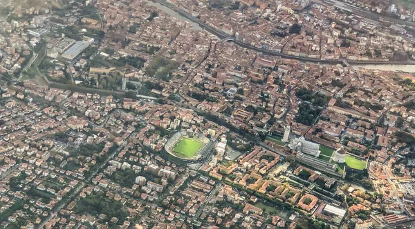 Aerial view of Pisa landmarks and homes from the airplane