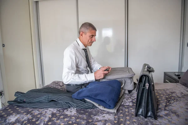 Businessman Packs His Suitcase Business Trip Briefcase Clothes Bed — Stockfoto