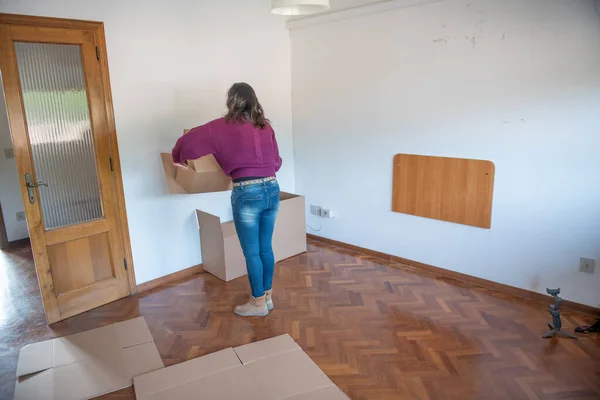 Back View Woman Tidying Cardboard Boxes Moving New House — Stockfoto