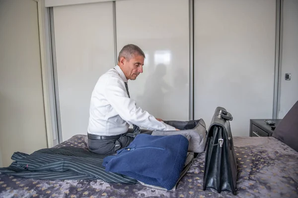 Businessman Packs His Suitcase Business Trip Briefcase Clothes Bed — Foto de Stock