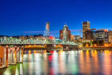 Modern night skyline of Portland with river light reflections, Oregon