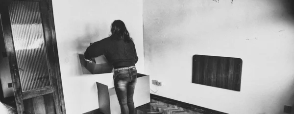 Back View Woman Tidying Cardboard Boxes Moving New House — Fotografia de Stock