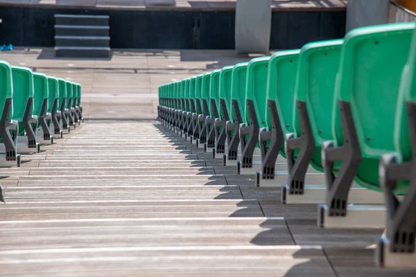 Open air theater green chairs.