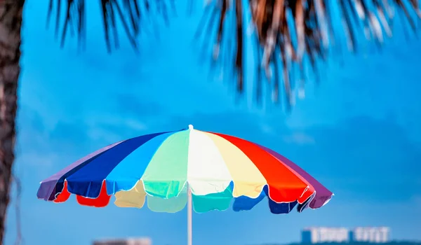 Colorful beach umbrella along the sea