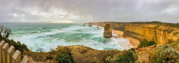 The Twelve Apostles rock formations along the Great Ocean Road, panoramic aerial view - Victoria, Australia.