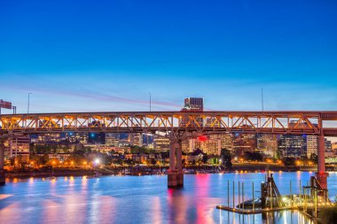 Modern night skyline of Portland with river light reflections, Oregon