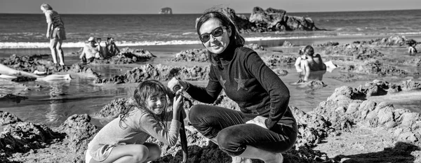 Young Girl Her Mother Building Sand Spa Hot Water Beach — 스톡 사진