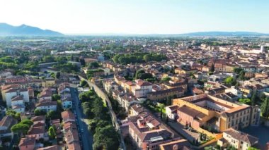 Pisa homes and streets at dawn from drone.