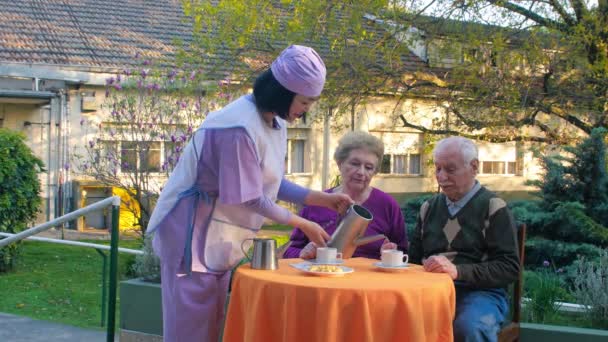 Couple Active Seniors Having Breakfast Outdoor — Vídeo de Stock