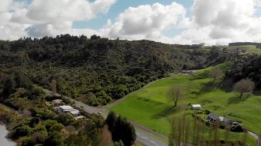 Countryside hills aerial view from drone at sunset, New Zealand.