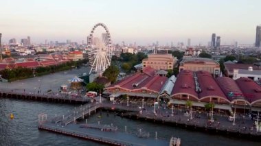 Bagkok, Thailand. Aerial view of the city along Chao Phraya River at dusk.