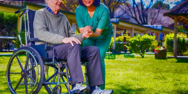 Asian Nurse Happy Caucasian Elder Patient Wheelchair Outdoor View — Stock Photo, Image