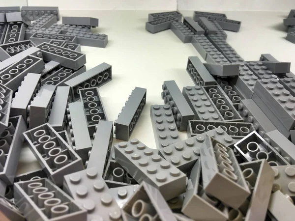 Grey Building Pieces Closeup Bright Plastic Constructor Pieces Neatly Accommodation — Stock Photo, Image