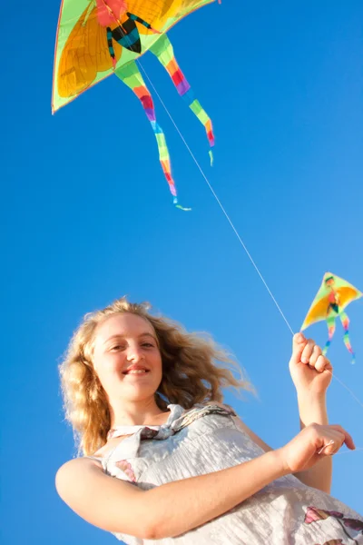 Blonde girl and flying kite — Stock Photo, Image