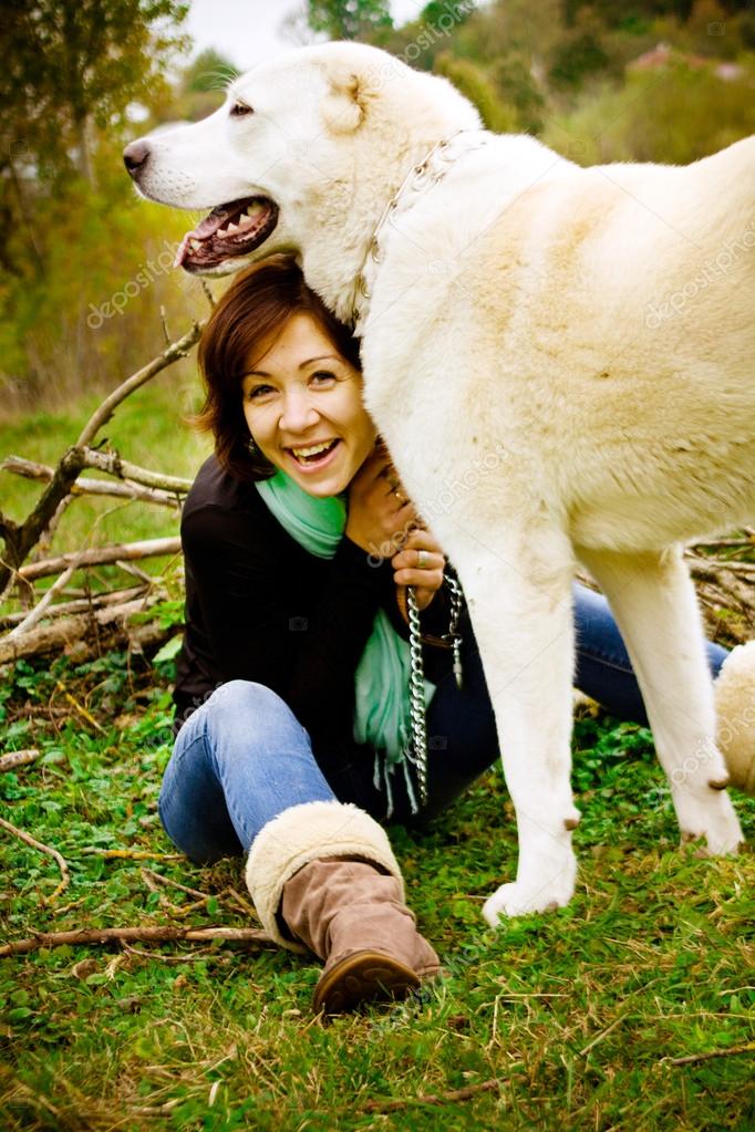 Girl and her best friend big white dog Alabai