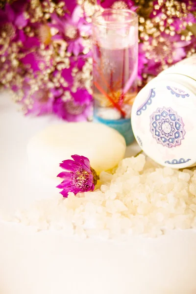 Jar of bath sea salt, soap and violet flowers — Stock Photo, Image