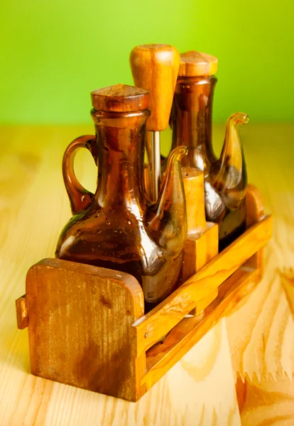 Bottles of olive on the wooden background — Stock Photo, Image