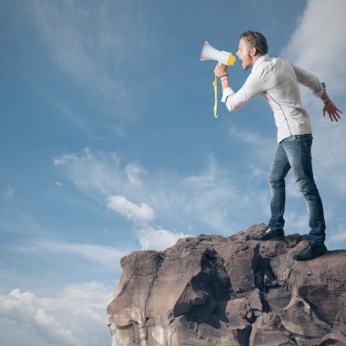 Boy screaming on the megaphone clipart