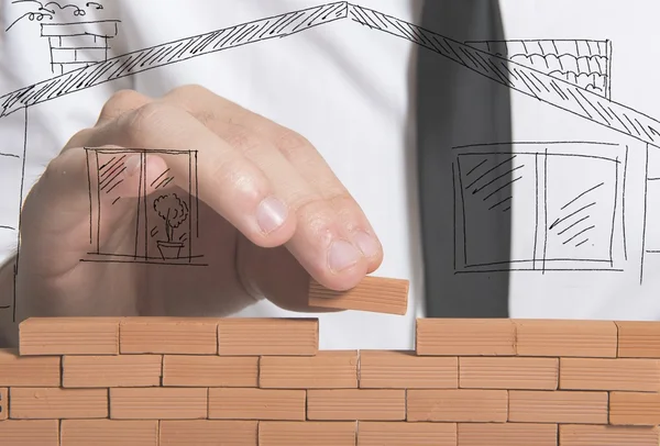 Affärsman bygger ett nytt hus — Stockfoto