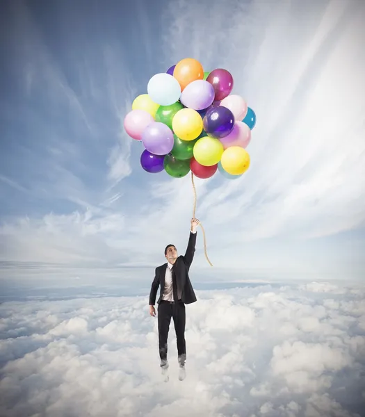 Businessman flying high — Stock Photo, Image