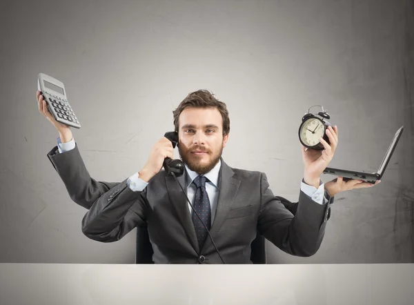 Businessman multitasking — Stock Photo, Image