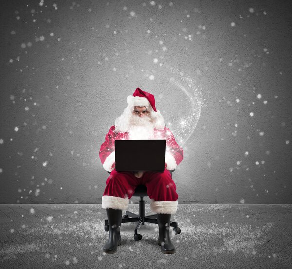 Santa Claus with laptop