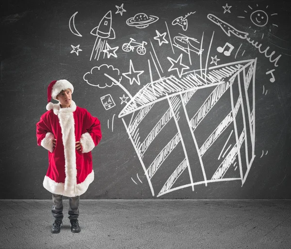 Child dreams christmas gifts — Stock Photo, Image