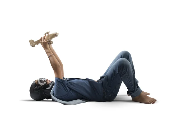 Young boy playing with toy airplane — Stock Photo, Image