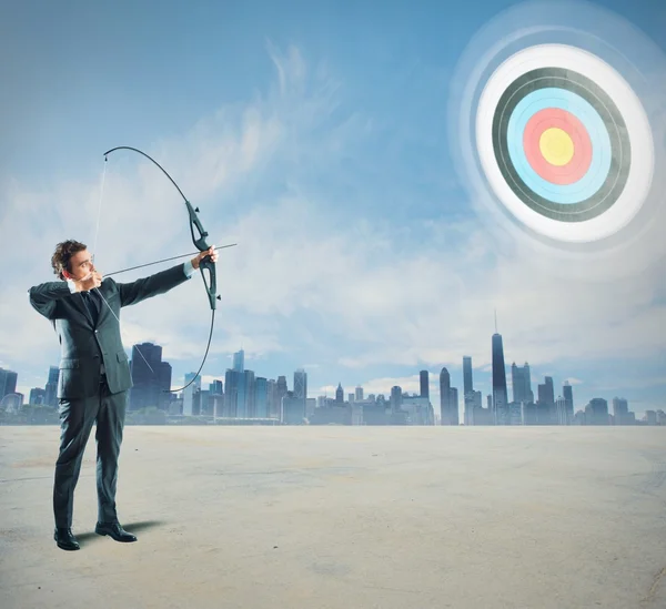 Businessman with bow and arrow — Stock Photo, Image