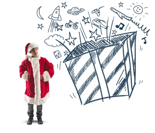 Child dreams christmas gifts — Stock Photo, Image