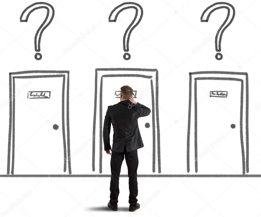 Businessman choosing the right door