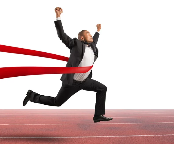 Successful businessman in a finishing line — Stock Photo, Image