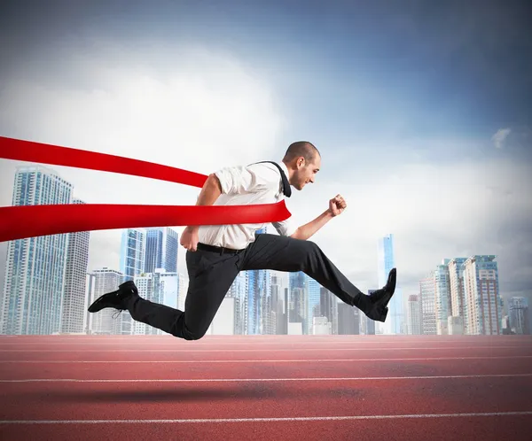 Successful businessman  on the finishing line — Stock Photo, Image