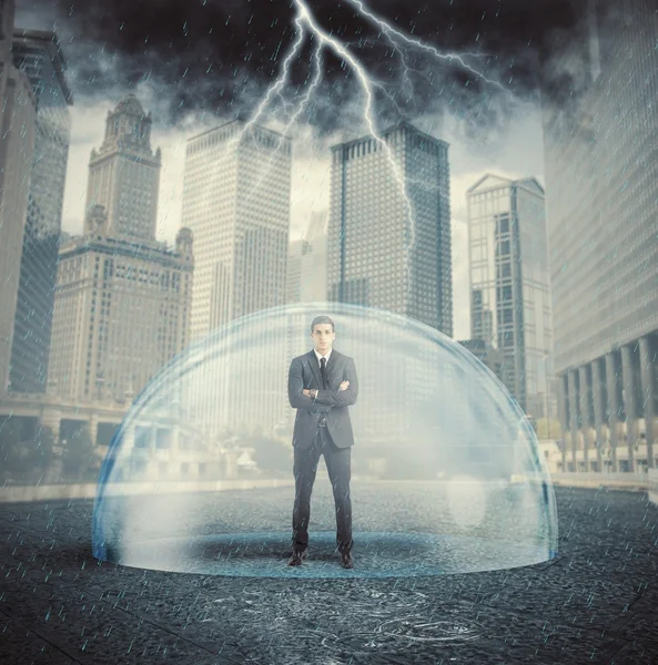 Businessman protected from the crisis — Stock Photo, Image