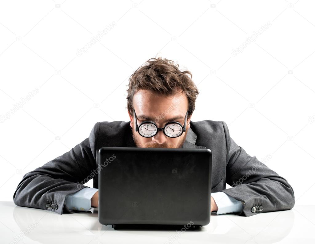 Businessman with clock in glasses and laptop