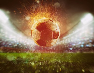Stadyumda golü atan ateşli bir futbol topuna yaklaş.