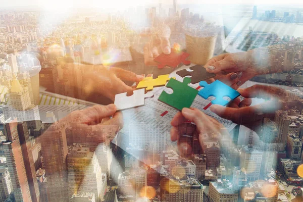 Teamwork of partners connect puzzle pieces as integration and startup — Stock Photo, Image