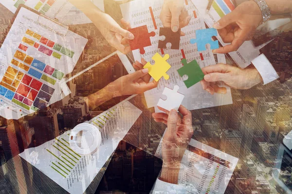 Teamwork of partners connect puzzle pieces as integration and startup — Stockfoto