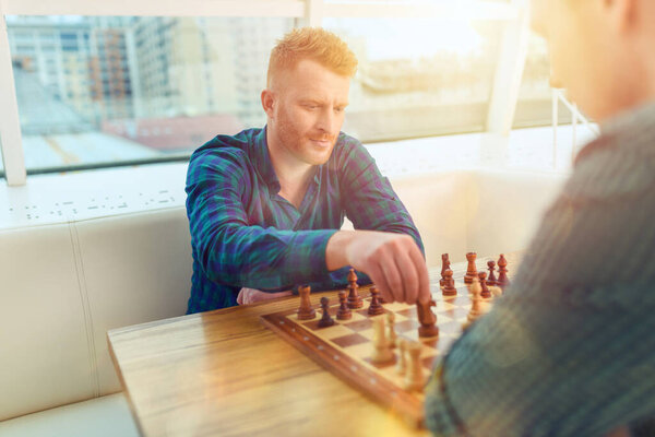 Businessmen play chess as strategy and tactic concept