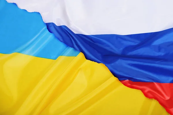 Antecedentes da bandeira do país Ucrânia versus a bandeira da Rússia — Fotografia de Stock