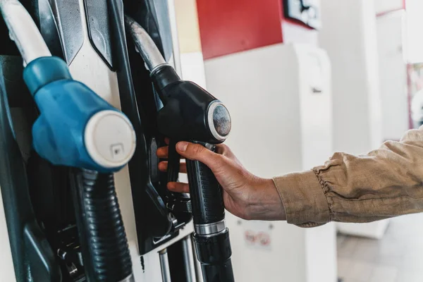 Fuel pump fill a tank of a car in a station — Stock Photo, Image
