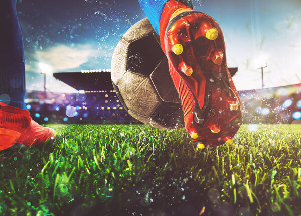 Футболист энергично бьет по мячу на стадионе