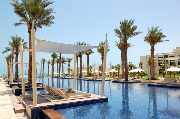 Huts at swimming pool of the luxury hotel, Saadiyat island, Abu