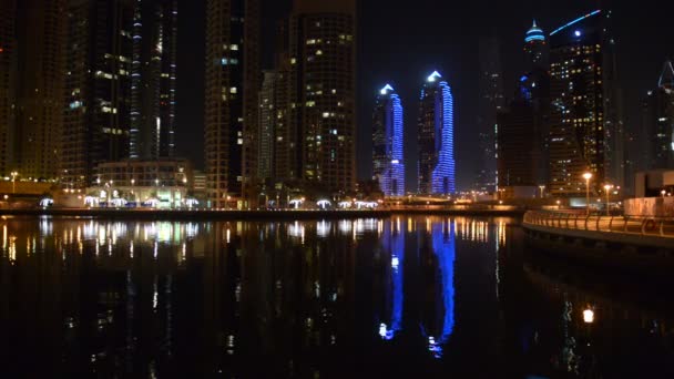 The night illumination of Dubai Marina. It is an artificial canal city, built along a two mile (3 km) stretch of Persian Gulf shoreline. Dubai, UAE — Stock Video