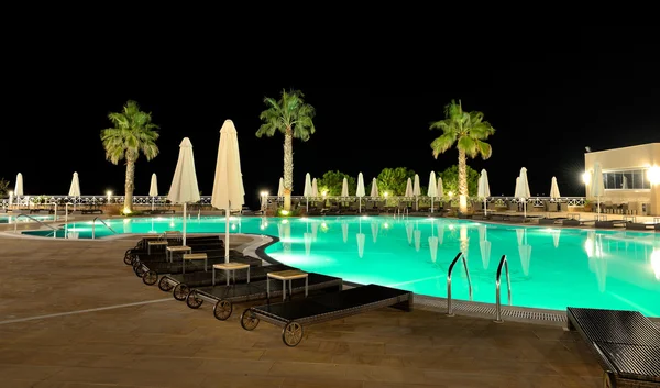 Swimming pool in night illumination, Halkidiki, Greece — Stock Photo, Image