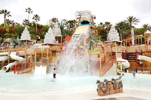 TENERIFE ISLAND, SPAIN - MAY 22: The kids playing in water attra