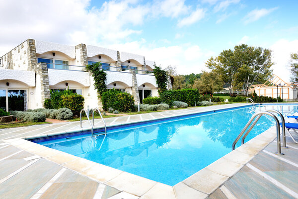 Swimming pools by villas at the luxury hotel, Halkidiki, Greece