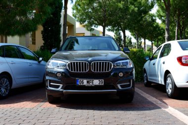 ANTALYA, TURKEY - APRIL 22: The BMW X5 car parked near modern luxury hotel on April 22, 2014 in Antalya, Turkey.