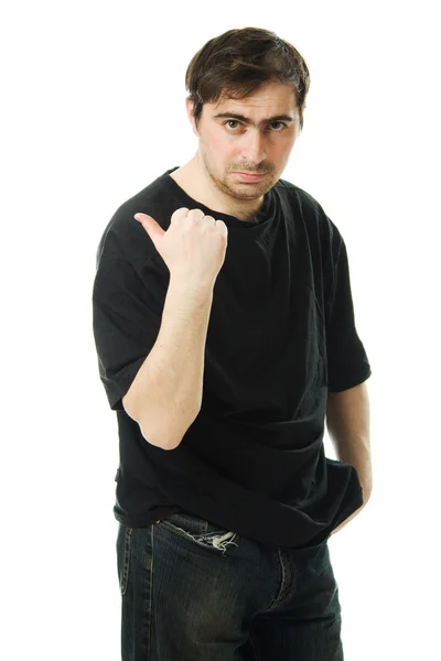 Man points a finger behind his back. — Stock Photo, Image